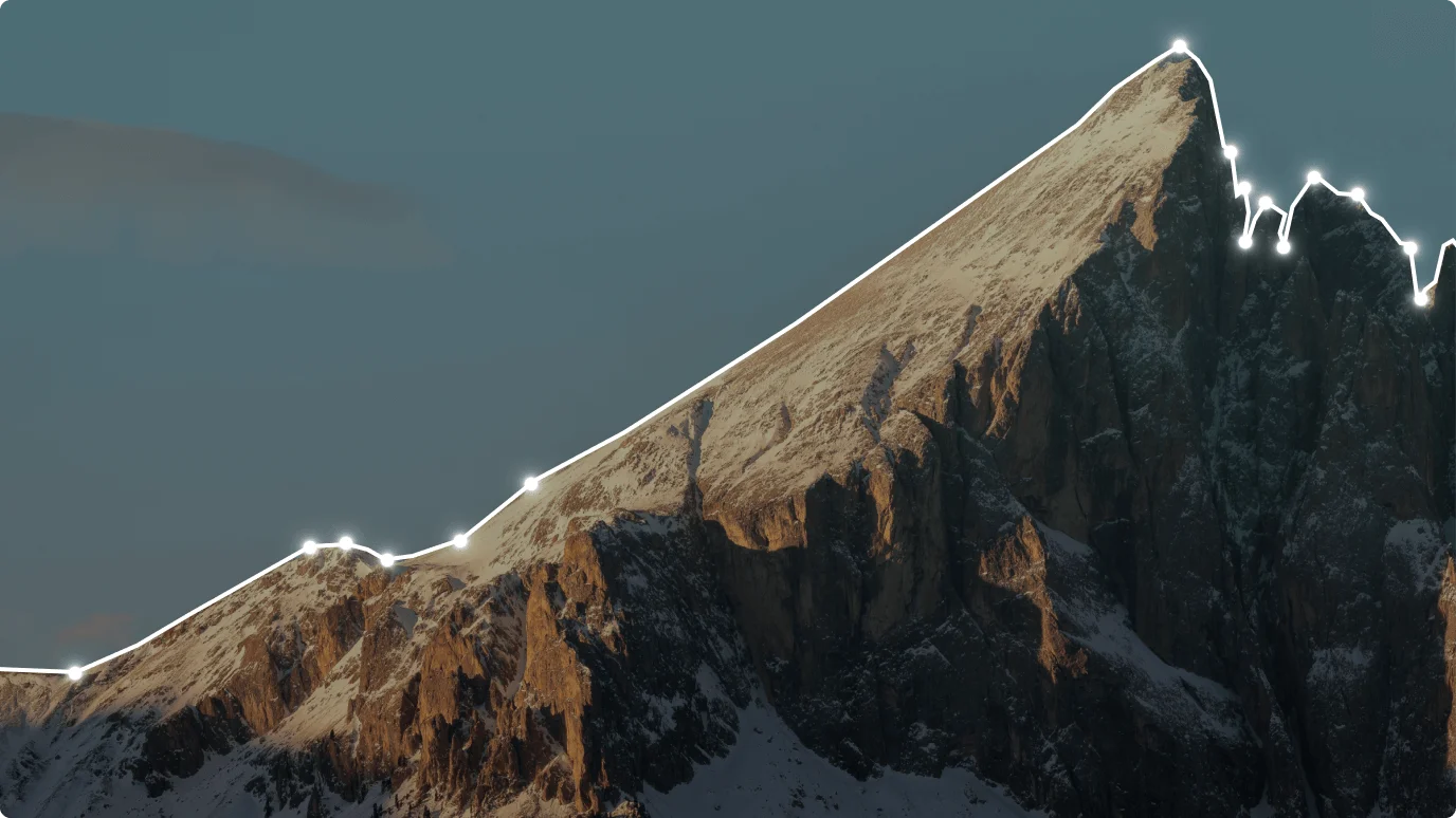 A snow-capped mountain that features a glacial landform. The landscape is a stunning combination of snow, sky, and natural beauty.