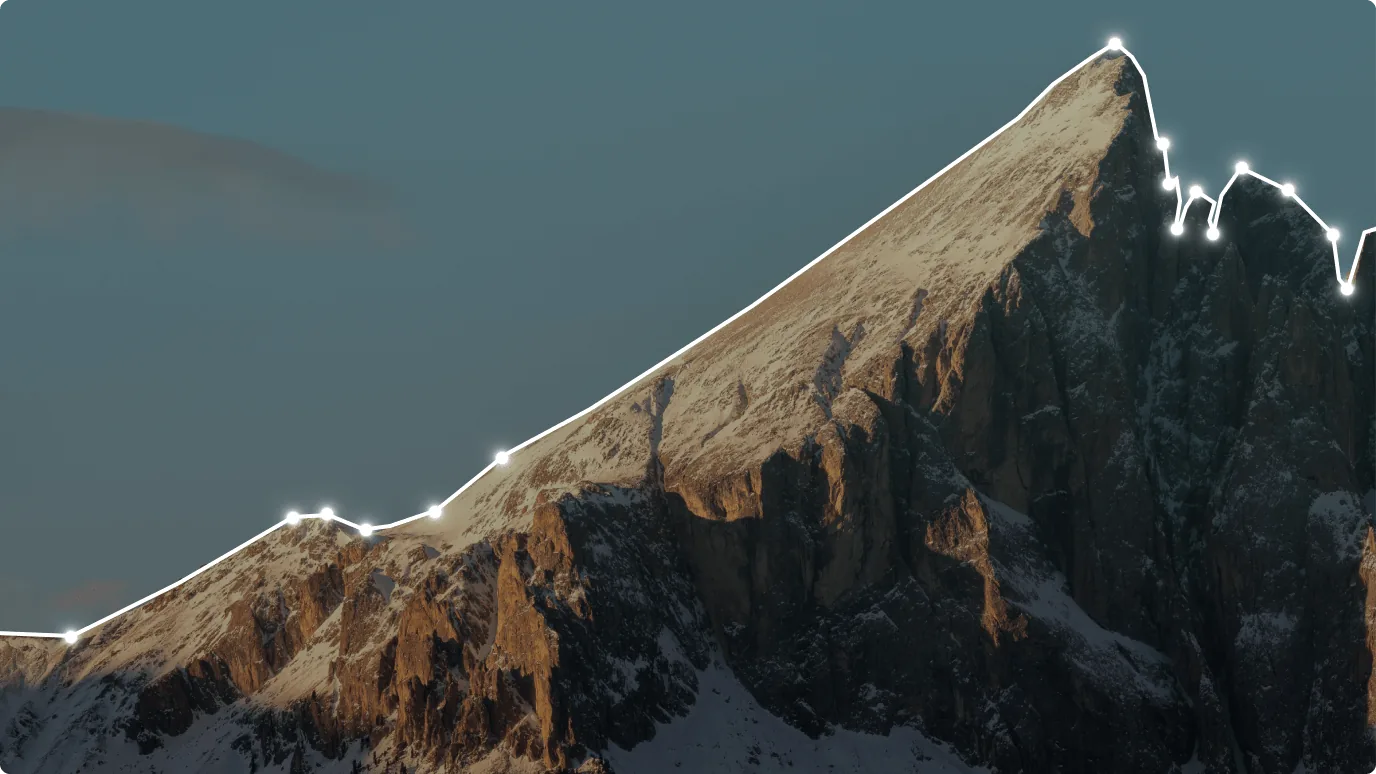 A snow-capped mountain that features a glacial landform. The landscape is a stunning combination of snow, sky, and natural beauty.